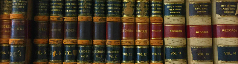 shelf of old journals at the Public Service Board